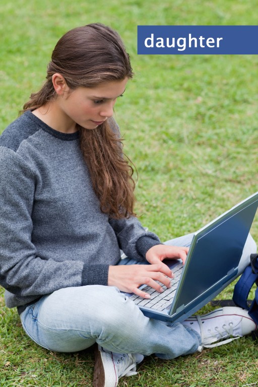 Girl on grass with laptop